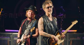Adrian Smith and Richie Kotzen pictured with their Jackson and Fender guitars at soundcheck