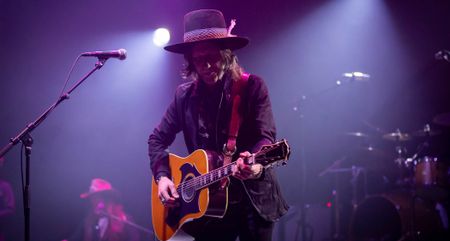 Charlie Star performs live with an acoustic guitar.
