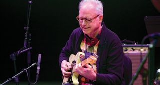 Bill Frisell in his element, onstage with a guitar