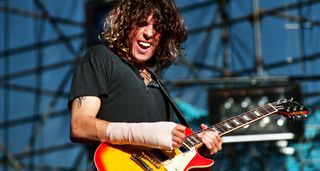 Dean DeLeo performs at the 1993 KROQ Weenie Roast with Stone Temple Pilots