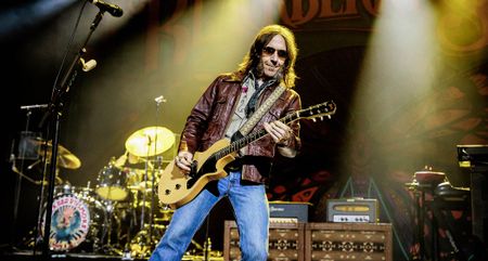 Charlie Starr wears shades and plays a Gibson Les Paul Junior onstage with Blackberry Smoke