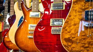 Close up of electric guitars hanging in a guitar shop