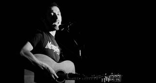 Richard Thompson performs live onstage in the early '80s.