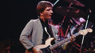Glenn Tilbrook, singer and guitarist with British pop group Squeeze, during a live concert performance by the band at Hammersmith Odeon, London, England, Great Britain, circa 1979