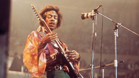Jimi Hendrix performs live on stage playing a black Fender Stratocaster guitar with The Jimi Hendrix Experience at the Royal Albert Hall in London on 24th February 1969